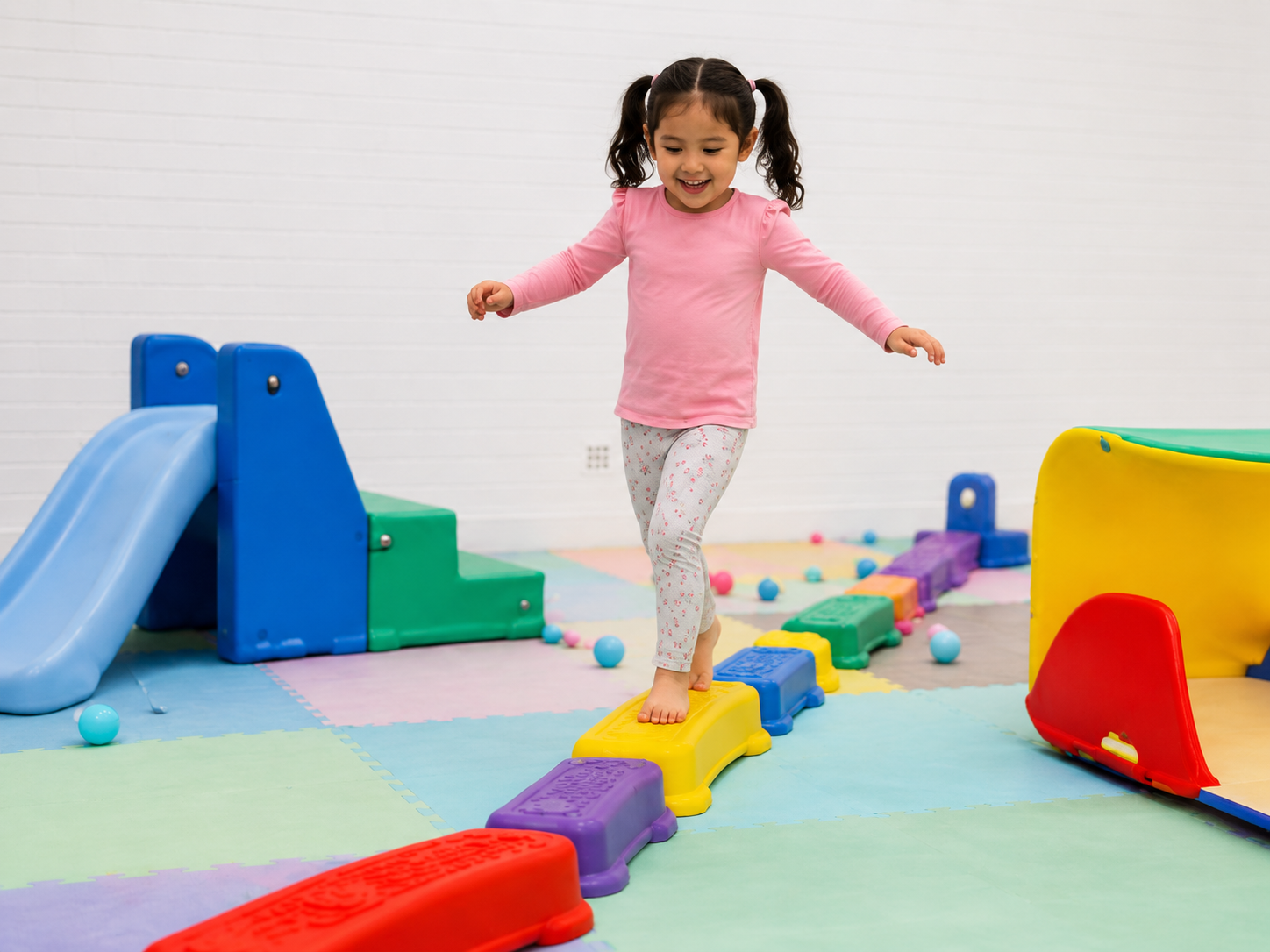 Child balancing along an obstacle course